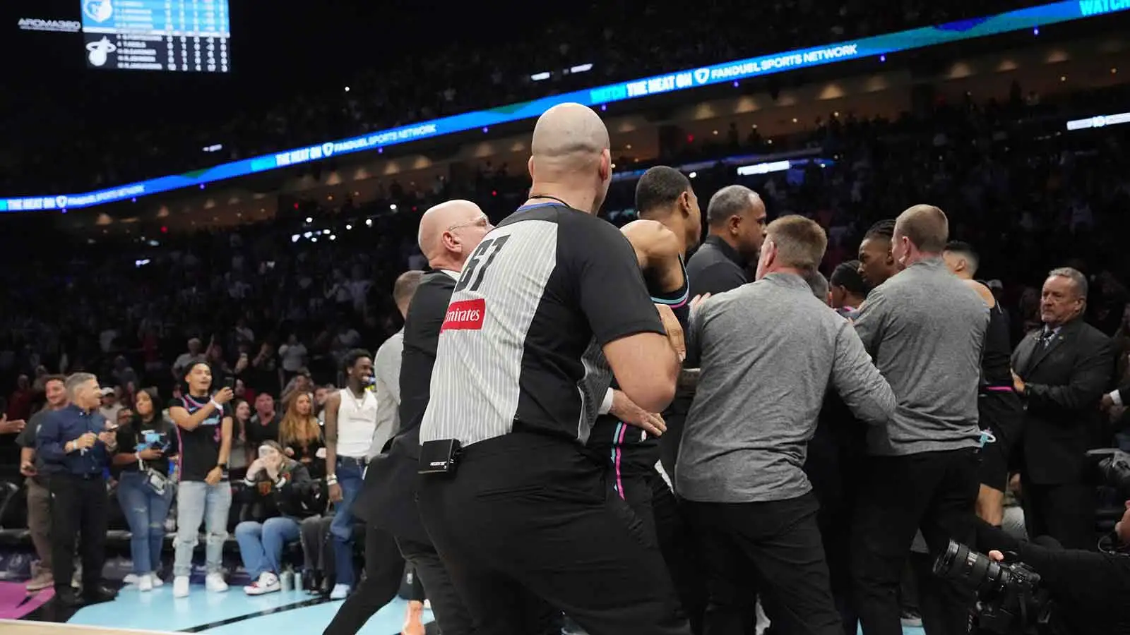 Scottie Pippen Jr. pushes Myron Gardner into the stands at Grizzlies-Heat