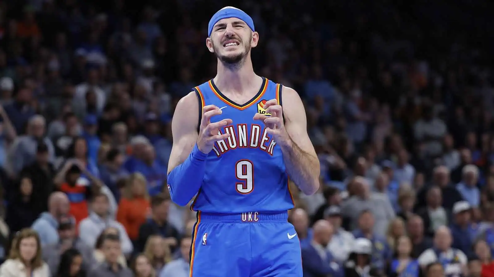 Alex Caruso tries his best to block a shot with a shoe